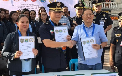<p><strong>FIRE SAFETY FOR CHILDREN.</strong> Marikina City Mayor Marcelino Teodoro (right), BFP-NCR director Chief Supt. Wilberto Rico Neil Kwan Tiu (middle), and DepEd-Marikina Superintendent Sheryll Gayola (left) ink a memorandum of understanding (MOU) on facilitating a monthly Fire Square Road Show program in the city, on Monday (Feb. 24, 2020). It aims to raise the level of awareness of children on disaster response, especially on fire incidents. <em>(Photo courtesy of Marikina City government)</em></p>