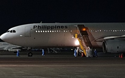 <p><strong>HOME.</strong> The second plane carrying another 136 repatriates from Japan arrived at 12:12 a.m. on Wednesday (Feb. 26, 2020). A total of 445 repatriates, 13 members of the DFA-DOH repatriation team, and PAL crew will be isolated for 14 days at the NCC Athletes' Village. <em>(DFA photo)</em></p>