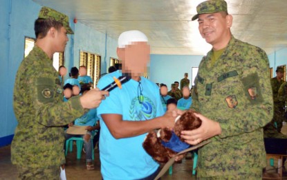 <p><strong>RETURNING HOME.</strong> Brig. Gen. Roberto S. Capulong (right), the Army’s 602nd Infantry Brigade commander, welcomes one of the former combatants of the Bangsamoro Islamic Freedom Fighters back to the mainstream society after he and 21 others have completed the initial phase of the reintegration program inside Camp Lucero, the brigade's headquarters in Carmen, North Cotabato on Wednesday. The returnees are former BIFF extremists who recently surrendered to the military’s 34th and 7th Infantry Battalions in the province. <em>(Photo courtesy of 602nd IBde)</em></p>