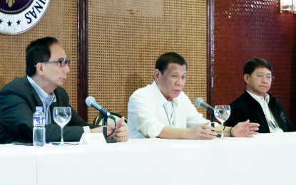 <p><strong>TASK FORCE VS. ASF.</strong> President Rodrigo Duterte convenes with Agriculture Secretary William Dar, Interior and Local Government Secretary Eduardo Año and other officials to discuss the updates on the African swine fever during a meeting at the Malacañan Palace Tuesday (Feb. 25, 2020). Duterte signed Executive Order No. 105 on February 21 creating a national task force to “oversee and implement effective and coordinated policies and strategies to manage, contain and control the spread of such diseases.” <em>(Presidential photo)</em></p>