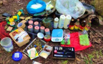 <p><strong>BOMB-MAKING MATERIALS.</strong> Homemade improvised explosive devices, bomb-making ingredients, and documents belonging to the Bangsamoro Islamic Freedom Fighters are discovered by government troops during a law enforcement operation on Thursday (Feb. 27, 2020) in the peripheries of the adjoining towns of Mamasapano, Datu Salibo, Shariff Aguak, Datu Saydona Mustapha, and Saudi Ampatuan. The BIFF combatants fled following a brief firefight, leaving behind their finished bombs and other bomb-making materials, the Army says. <em>(Photo courtesy 57IB)</em></p>