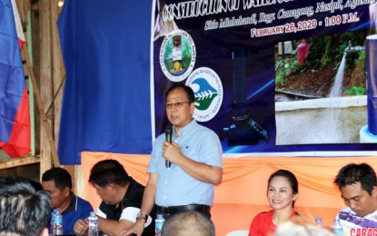 <p><strong>WATER FOR PEACE.</strong> Secretary Carlito G. Galvez, Jr. (standing) of the Office of the Presidential Adviser on the Peace Process (OPAPP) and Agusan del Norte 2nd District Rep. Ma. Angelica Amante-Matba (2nd from right) lead the turn-over of the PHP30 million potable water supply system level II project in Sitio Midbahandi, Camagong, Nasipit, Agusan del Norte on Wednesday, February 27. The project is part of the government's effort to reach out to conflict-affected areas and address the problem of communist insurgency. <em>(PNA photo by Alexander Lopez)</em></p>