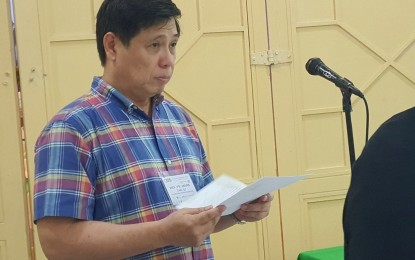 <p><strong>PLANTING MANGROVES.</strong> Fr. Mars Tan, director of the McKeough Marine Center of Xavier University -Ateneo de Cagayan, prepares his notes as he moderates a session on the 3rd Philippine Environment Summit in Cagayan de Oro City on Thursday (Feb. 27, 2020). The center is set to plant 70,000 mangroves along the Macajalar Bay covering Cagayan de Oro City and the coastal areas of Misamis Oriental province. <em>(PNA photo by Nef Luczon)</em></p>