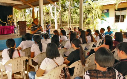 <p><strong>PROTECT THE YOUTH.</strong> Lt. Col. Francisco Molina (standing, center), commander of the Army's 23rd Infantry Battalion, is shown conducting campaign among students in Sangay National High School in Buenavista, Agusan del Norte recently. Molina on Friday (Feb. 28, 2020) welcomes the call of Secretary Carlito Galvez Jr., of the Office of the Presidential Adviser on the Peace Process, for the communist rebel movement to stop using child soldiers.<em> (PNA photo by Alexander Lopez)</em></p>