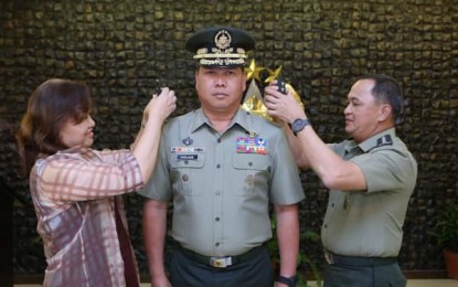 <p><strong>PROMOTED.</strong> AFP chief Felimon Santos Jr. (right) leads the donning ceremony for newly-promoted Lt. Gen. Antonio Parlade Jr. in Camp Aguinaldo, Quezon City on Thursday (Feb. 27, 2020). Prior to his designation as Solcom chief, Parlade previously led the AFP’s Office of the Deputy Chief of Staff for Civil-Military Operations and is a key official of the National Task Force to End Local Communist Armed Conflict (NTF-ELCAC). <em>(Photo courtesy of AFP Public Affairs Office)</em></p>