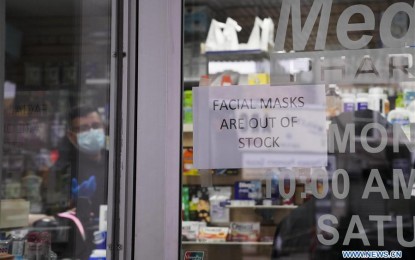 <p><strong>FIRST US COVID-19 DEATH.</strong> A notice showing "facial masks are out of stock" is seen on a door of a pharmacy in New York, the United States, Feb. 29, 2020. The Washington State Department of Health confirmed the first death in connection with coronavirus disease 2019 Saturday as more cases of unknown origin were reported in western US states. <em>(Xinhua/Wang Ying)</em></p>