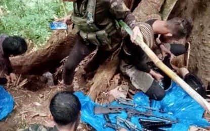 <p><strong>FIREARMS CACHE.</strong> Troops from the Army’s 73rd Infantry Battalion recover on Saturday at least two high-powered firearms reportedly stashed by members of the communist New People’s Army in a forested area in Sitio Salyan, Barangay Sapu Masla in Malapatan town, Sarangani province. The firearms were located based on information from an NPA combatant who voluntarily surrendered to the Army unit. <em>(Photo courtesy of the Army’s 73IB)</em></p>