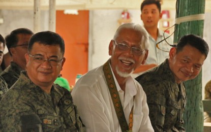 <p><strong>BACK TO BARRACKS.</strong> Retired Col. Alexander Noble (center), together with 402nd Infantry Brigade commander, Brig. Gen. Maurito Licudine (left), and deputy commander, Col. Cerilo C. Baloro Jr. (right), joins the commemoration of the 37th founding anniversary of the Army's 23rd Infantry Battalion of the Philippine Army on Sunday (March 1, 2020) in Barangay Alubihid, Buenavista, Agusan del Norte. Noble believes insurgency is an economic problem that needs to be countered by the unified efforts of all government agencies.<em> (PNA photo by Alexander Lopez)</em></p>
