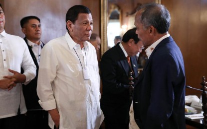 <p><strong>NUCLEAR ENERGY</strong>. President Rodrigo Roa Duterte chats with Energy Secretary Alfonso Cusi prior to the start of the 47th Cabinet meeting at the Malacañan Palace on Monday (March 2, 2020). Cusi is seeking approval of a proposed executive order to include nuclear power in the Philippines’ energy mix. <em>(Presidential photo by Simeon Celi Jr.)</em></p>