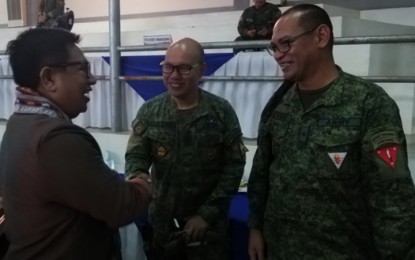 <p><strong>STATE OF THE PROVINCE.</strong> Basilan Governor Hadjiman Hataman-Salliman (left) shares light moments with Brig. Gen. Fernando Reyeg, Army's 101st Infantry Brigade commander (right) and Lt. Col. Achiles Dela Cruz (center) after his State of the Province Address Thursday (March 5, 2020) at the amphitheater of the Basilan State College in Barangay Sumagdang, Isabela City, the capital of the province. Salliman touted the zero kidnapping incidents in the past four years. <em>(PNA photo by Teofilo P. Garcia, Jr.)</em></p>