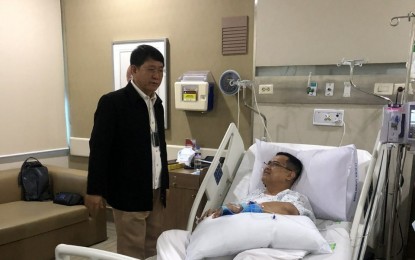<p><strong>VISIT TO PNP CHIEF. </strong>Interior Secretary Eduardo Año (left) visits PNP chief, Gen. Archie Gamboa in his private room at the St. Luke's Medical Center in Taguig City on Thursday (March 5, 2020). Año has designated Lt.  Gen. Camilo Cascolan as PNP officer-in-charge (OIC) after Gamboa and seven others were injured in a helicopter crash in San Pedro, Laguna. <em>(Photo courtesy of DILG Secretary Eduardo Año)</em></p>