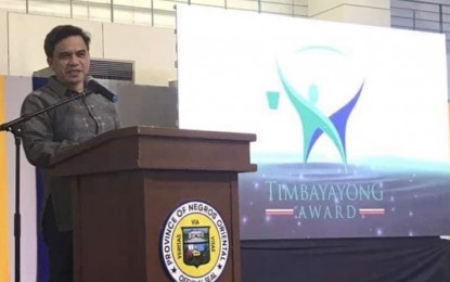<p><strong>ANTI-INSURGENCY PROJECTS</strong>. Department of the Interior and Local Government (DILG-7) regional director Leocadio Trovela delivers his message during the Timbayayong Award for Outstanding LGU and NGO Partners event in Dumeguete City, Negros Oriental on Aug. 3, 2019. Trovela said the Regional Task Force to End Local Communist Armed Conflict in Central Visayas is tapping more funds to bankroll projects to address issues sees as root causes of insurgency in Negros Oriental. <em>(Photo courtesy of DILG-7)</em></p>