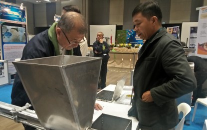 <p><strong>INVENTION TO INNOVATION.</strong> Science and Technology Secretary Fortunato dela Peña checks one of the entries in the National Invention Contest & Exhibits (NICE), held in SMX Aura, BGC, Taguig City on March 3-5, 2020. The Department of Science and Technology is urging NICE winners to turn their invention into innovation. <em>(PNA photo by Cristina Arayata)</em></p>