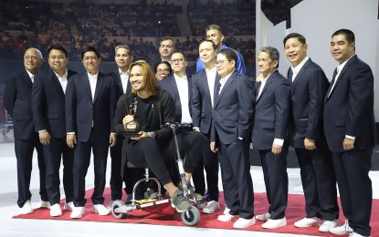 <p><strong>6TH MVP AWARD.</strong>  June Mar Fajardo (on a mobility scooter) poses with other Philippine Basketball Association officials shortly after he received his sixth MVP trophy Sunday (March 8, 2020). Fajardo bested Columbian's CJ Perez, NorthPort's Chris Standhardinger and TNT's Jayson Castro for the league's top individual prize. <em>(Photo courtesy of the PBA Media Group)</em></p>