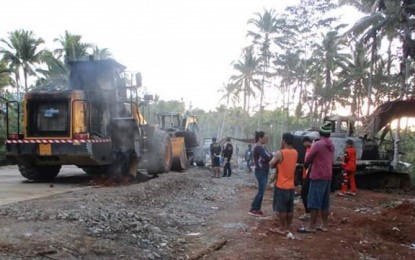 <p><strong>SET ABLAZE.</strong> Suspected communist New People's Army rebels torch late Monday (March 9, 2020) four units of heavy equipment belonging to a construction firm undertaking a government road concreting project in Barangay Lower Liasan, Tambulig, Zamboanga del Sur. No one was hurt during the attack. <em>(Photo courtesy of Tambulig Municipal Disaster Risk Reduction Management Office)</em></p>
