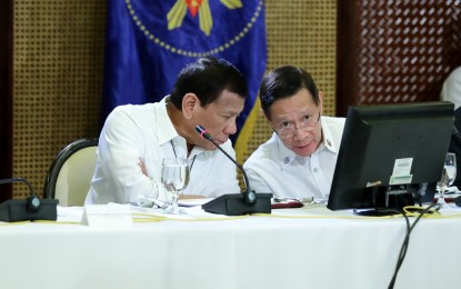 <p>President Rodrigo Duterte and Health Secretary Francisco Duque III <em>(File photo)</em></p>