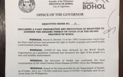 <p><strong>COMMUNITY QUARANTINE.</strong> Photo shows a copy of the Executive Order signed by Bohol Governor Arthur Yap on Friday (March 13, 2020), placing Bohol Province under community quarantine as a preventive measure against the coronavirus disease 2019 (Covid-19). Under the EO, starting from midnight of March 16 until March 20, only outbound travels are allowed while inbound will be prohibited. <em>(PNA photo by Angeline Valencia)</em></p>