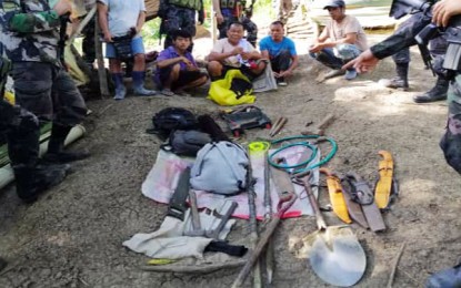 <p><strong>ILLEGAL TREASURE HUNT.</strong> Five individuals suspected of conducting illegal treasure hunting are arrested by the personnel of Butuan City Police Office Station 5 (BCPO-5) on Friday (March 13, 2020) in Barangay Tungao, Butuan City. The suspects face charges for illegal treasure hunting and unauthorized excavation. <em>(Photo courtesy of BCPO Information Office)</em></p>