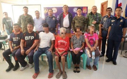 <p><strong>REBEL RETURNEE.</strong> Loreto "Ka Nestor" Ventura (seated, red shirt), a 79-year-old former New People’s Army squad leader, joins relatives, Cagayan officials, Army, police, and fire bureau officers when he was presented to the media on Thursday (March 12, 2020). Ventura gave himself up to the Cagayan provincial government and police officials in Barangay Lagum, Santo Niño, Cagayan. <em>(PNA photo by Vince Jacob A. Visaya)</em></p>