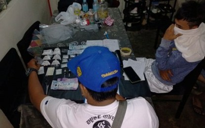 <p><strong>DRUG SUSPECT</strong>. Suspect Mark Sy (right), 20, was arrested in a buy-bust conducted by operatives of Bacolod City Police Office Station 2 in CityVille Subdivision, Barangay Estefania around 7:30 p.m. on Sunday (March 15, 2020). He yielded 240 grams of suspected shabu with an estimated value of PHP1.92 million. <em>(Photo courtesy of Bacolod City Police Office)</em></p>