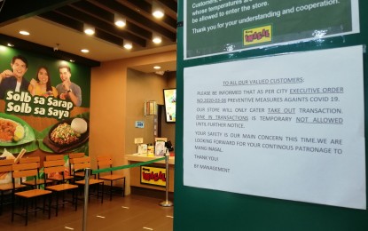 <p><strong>NO DINE-IN.</strong> A notice posted outside a food chain in Tacloban City 6informing consumers on the no dine-in policy. The city government here on Sunday (March 15, 2020) issued a directive imposing a no dine-in policy in restaurants and liquor ban to protect the public from possible exposure to the coronavirus disease 2019 (Covid-19). <em>(PNA photo by Sarwell Meniano)</em></p>