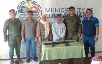 <p><strong>SURRENDER</strong>. A Dawlah Islamiya fighter, Bokharie Macadato Mahmod (3rd from right) surrenders on Monday (March 16, 2020) to the government troops in Sultan Dumalondong, Lanao del Sur. Mahmod was involved in clashes against the government forces in Butig and Marawi City from 2016 up to 2017.<em> (Photo courtesy of Western Mindanao Command Public Information Office)</em></p>