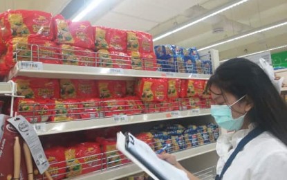 <p><strong>ADEQUATE SUPPLY.</strong> Julia Joy Salcedo of the Department of Trade and Industry price monitoring inspects the price and supply of goods at a supermarket in San Jose de Buenavista on Monday (March 16, 2020). DTI assures consumers of enough supply of basic necessities in the province of Antique. <em>(Photo courtesy of DTI Antique)</em></p>