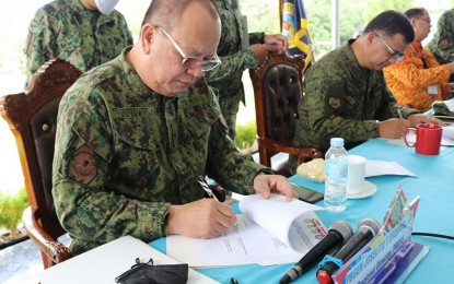 <p><strong>TASK FORCE VS. COVID-19.</strong> Brig. Gen. Joselito Esquivel Jr. (left) of Police Regional Office in Caraga Region and Brig. Gen. Maurito Licudine (2nd from left) of the Army's 402nd Infantry Brigade lead the creation of the Inter-Agency Task Force-Coronavirus Caraga Shield on Tuesday (March 17). The task force will support other agencies and local government units in enforcing laws to contain the spread of Covid-19. <em>(Photo courtesy of PRO-13 Information Office)</em></p>