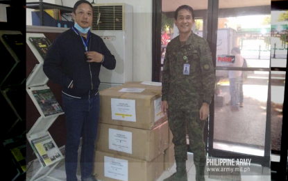 <p><strong>FACE MASKS FOR TROOPS.</strong> Philippine International Trading Corporation (PITC) Undersecretary Dave Almarinez (left) turns over boxes containing 15,000 face masks to PA assistant chief-of-staff for civil-military operations, Col. Patricio Ruben Amata (right), in Fort Bonifacio, Taguig City on Wednesday (March 18, 2020). The face masks were donated by Indian defense company MKU Limited. <em>(Photo courtesy of Army Public Affairs Office)</em></p>