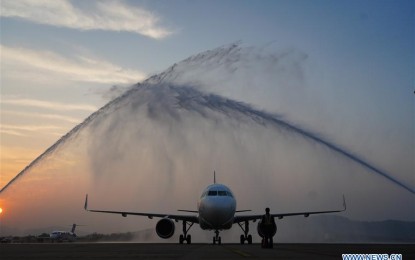 <p><strong>SALUTE TO HEALTH WORKERS.</strong> An airplane carrying medical workers supporting virus-hit Hubei Province receives a water cannon salute as it lands at Changbei International Airport in Nanchang, east China's Jiangxi Province, on March 18, 2020. Medical assistance teams started leaving Hubei Province as the epidemic outbreak in the hard-hit province has been subdued. <em><strong>(Xinhua/Zhou Mi)</strong></em></p>
