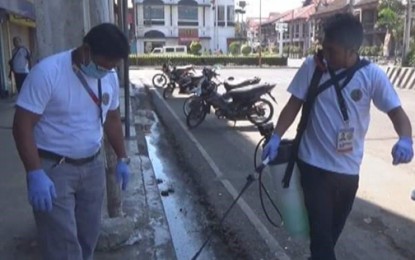 <p><strong>DISINFECTION.</strong> Personnel of the City Health Office on Friday (March 20, 2020) disinfect downtown Zamboanga City as the enhanced community quarantine took effect earlier. A similar undertaking has been done in Pagadian City. <em>(PNA photo by Salvador A. Santiago)</em></p>