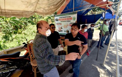 <p><strong>ENHANCED QUARANTINE.</strong> Sarangani Governor Steve Chiongbian Solon (left) and Dr. Arvin Alejandro (right), provincial health officer, inspect a border checkpoint in Alabel town on Friday. The entire province was placed under general community quarantine starting Thursday (March 19, 2020) to contain the spread of the coronavirus disease 2019. <em>(Photo courtesy of the Provincial Information Office)</em></p>