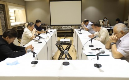 <p>Government officials say a prayer before they start a discussion on (March 21, 2020). (Contributed photo)</p>