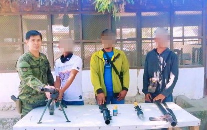 <p><strong>BIFF SURRENDERERS.</strong> Lt. Colonel Rommel Valencia, commander of the Army’s 7th Infantry Battalion accepts three members of the outlawed Bangsamoro Islamic Freedom Fighters who yielded to them on Friday (March 20) in Kabacan, North Cotabato. The surrenderers said they longed to be with their families after being duped into fighting a futile cause. <em>(Photo courtesy of 7IB)</em></p>
