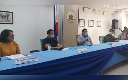 <p><strong>1ST POSITIVE CASE.</strong> Department of Health-6 Director Dr. Marlyn Convocar (from left to right), Iloilo Governor Arthur Defensor Jr., and Iloilo City Mayor Jerry Treñas, and other government officials hold a press conference on Saturday (Mar. 20, 2020) regarding the first confirmed case of coronavirus disease 2019 (Covid-19) in Iloilo province. The 65-year-old male patient from Guimbal town is admitted at a hospital in Iloilo City and in unstable condition. <em>(PNA photo courtesy of Iloilo City Government)</em></p>