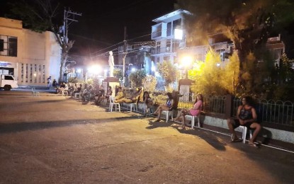 <p><strong>HARD LESSON</strong>. Curfew violators in Gumaca, Quezon spend the night outside the municipal hall, seating on plastic chairs. They were sent home by the authorities after the curfew hours.<em> (Photo courtesy of Mayor Webster Letargo)</em></p>