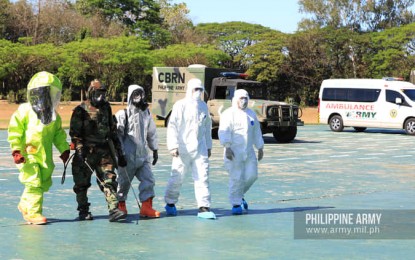 <p><strong>DISINFECTION</strong>. Chemical, Biological, Radiological and Nuclear (CBRN) unit of the Philippine Army is shown during the Army's 123rd founding anniversary ceremonies at Fort Bonifacio, Taguig City on Monday (March 23, 2020). The CBRN unit helps disinfect troops deployed in the checkpoints. <em>(Photo courtesy of PA)</em></p>