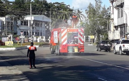 <p><strong>DISINFECTION. </strong>Firetrucks deployed in Tacloban streets for the 23-day disinfection activities in the city's 138 villages. Firefighters have started on Sunday (March 22, 2020) its daily disinfection drive while the city is under restrictive community quarantine in the bid to prevent the spread of coronavirus disease 2019. <em>(PNP photo by Roel Amazona)</em></p>