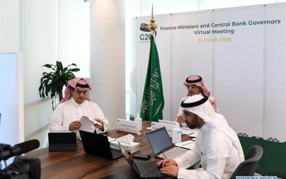 <p><strong>ACTION PLAN FOR COVID-19</strong>. Governor of Saudi Arabian Monetary Authority Ahmed al-Kholifey (left) and Saudi Finance Minister Mohammed al-Jadaan (rear) attend the G20 Finance Ministers and Central Bank Governors Virtual Meeting in Riyadh, Saudi Arabia, on March 23, 2020. The G20 finance ministers and central bank governors agreed on Monday during a televised meeting to develop a joint G20 Action Plan in response to the COVID-19, said a statement by the G20 Saudi secretariat. <em>(G20 Saudi Arabia/Handout via Xinhua)</em></p>