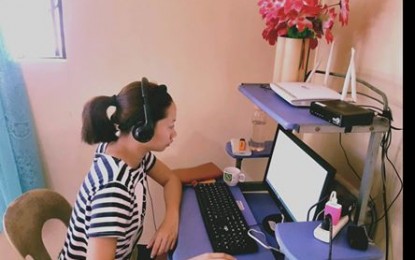 <p><strong>WORK FROM HOME.</strong> A Filipina working from home during the Coronavirus disease 2019 pandemic in the country. PLDT on Wednesday announced it offers free trial access to several business-grade communications tools to enterprise customers to enable a more conducive work-from-home environment. <em>(Photo courtesy of Robert John Nievares)</em></p>