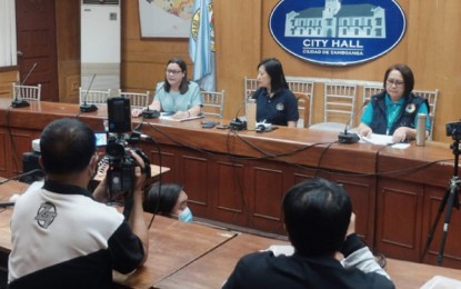 <p><strong>POSITIVE.</strong> Mayor Maria Isabelle Climaco-Salazar, the chairperson of the Task Force Covid-19 (center), announces in a press conference Tuesday evening (March 24, 2020) that a 29-year-old male with travel history from Manila is positive of coronavirus disease 2019 (Covid-19). It is the first case registered in this city. To her right is Dr. Dulce Amor Miravite, City Health Office chief, and Dr. Emilia Monicimpo, Department of Health regional director. <em>(Photo courtesy of City Hall Public Information Office)</em></p>