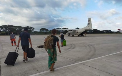 <p><strong>RESCUE MISSION</strong>. Seventeen Russians and a Filipino woman, who is the wife of one of the foreigners, were flown out of Negros Oriental on Wednesday afternoon (March 25, 2020) on board a Philippine Air Force aircraft. This is the first "sweeper flight" provided by government to rescue foreigners who were stranded due to travel restrictions so they can return to their countries of origin. <em>(Photo courtesy of CAAP-Negros Oriental)</em></p>