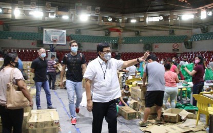 <p><strong>LOCKDOWN</strong>. Mayor Edgardo Labella supervises the repacking of goods for distribution to residents after placing Cebu City under a state of enhanced community quarantine from March 28-April 28, 2020. Labella said the city-wide lockdown is aimed at warding off the new coronavirus disease.<em> (Photo from Mayor Labella's Facebook page)</em></p>