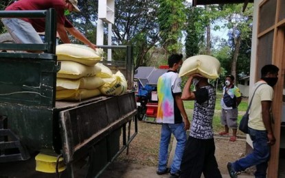 <p><strong>RICE AID.</strong> Workers haul rice on Friday (March 27, 2020) for the municipality of Margosatubig, Zamboanga del Sur in preparation for distribution to poor families affected by the enhanced community quarantine amid the coronavirus disease 2019. Zamboanga del Sur’s provincial government has purchased some PHP86 million worth of rice as subsidy to 137,000 families of minimum wage-earners and poor families across the province.<em> (Photo courtesy of Jeesrel Himang, Zamboanga del Sur provincial information officer)</em></p>