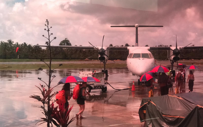 <p><strong>AID FOR STRANDED TOURISTS.</strong> Tourists in the Caraga region board a plane bound for airports in Luzon where they will take flights back to their home countries, on March 22, 2020. The Department of Tourism 13 (Caraga) has assisted more than 1,000 foreigners who were affected by the land and air travel restrictions due to the enhanced community quarantine in Luzon. <em>(Photo courtesy of DOT)</em></p>