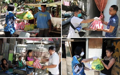 <p><strong>FOOD PACKS FOR INDIGENTS.</strong> Indigent families in Barangay Salitran III in Dasmarinas City, Cavite receive food packs from village personnel headed by Chairman George del Rosario on Monday (March 23, 2020). The food packs, which came from the city government, are part of its initiatives to help households cope with the coronavirus disease 2019 (Covid-19) crisis. <em>(PNA photo by Gil Calinga)</em></p>