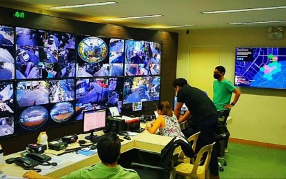 <p><strong>BARANGAY INITIATIVE.</strong> Barangay San Antonio, Pasig Chairman Raymond Lising shows their Command Center where the 73 AI-equipped closed-circuit television cameras are being monitored to ensure social distancing is observed during the enhanced community quarantine. <em>(Photo courtesy of Barangay San Antonio, Pasig)</em></p>