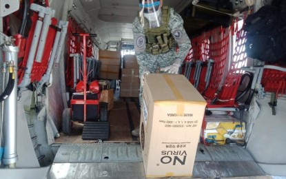 <p><strong>MEDICAL AID.</strong> A military personnel unloads one of the 31 boxes of donated personal protective equipment on Saturday (March 28, 2020) at the Iloilo International Airport from the Brig. Gen. Benito N. Ebuen Air Base in Cebu. Aside from medical equipment and supplies, the military also transports Covid-19 test kits and specimens.<em> (PAF photo)</em></p>