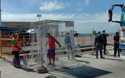 <p><strong>SAFETY MEASURES.</strong> Personnel of the Philippine Coast Guard (PCG) station in Iloilo implements measures against the spread of the coronavirus disease 2019 (Covid-19) at Lapuz Wharf in Dumangas Port in Iloilo on Sunday (March 29, 2020). The PCG said a total of 2,557 vessels were inspected by a government maritime task force, which included medical screening and health protocols for its crew. <em>(Photo courtesy of PCG)</em></p>