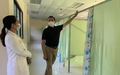 <p><strong>ISOLATION ROOMS</strong>. Bohol Governor Arthur Yap inspects the isolation rooms constructed inside the Capitol Annex that are ready for occupancy. He said patients who would exhibit influenza-like symptoms would be brought to this 80-bed facility.<em> (Photo courtesy of Gov. Arthur Yap)</em></p>